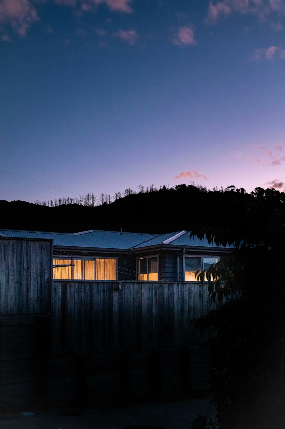 Architectural home illuminated at blue hour